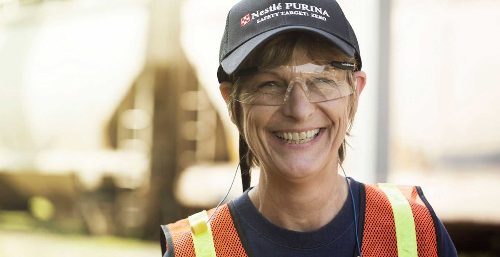 Woman smiling with safety glasses on