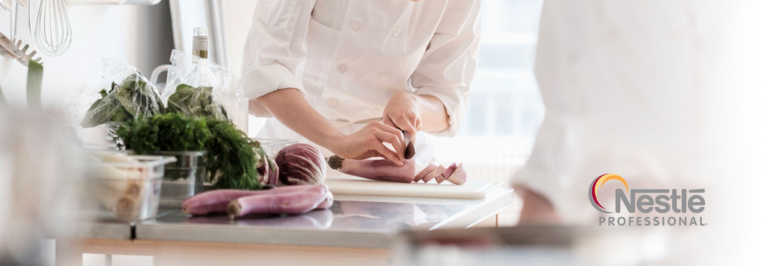 Close up of a chef slicing meat on a table