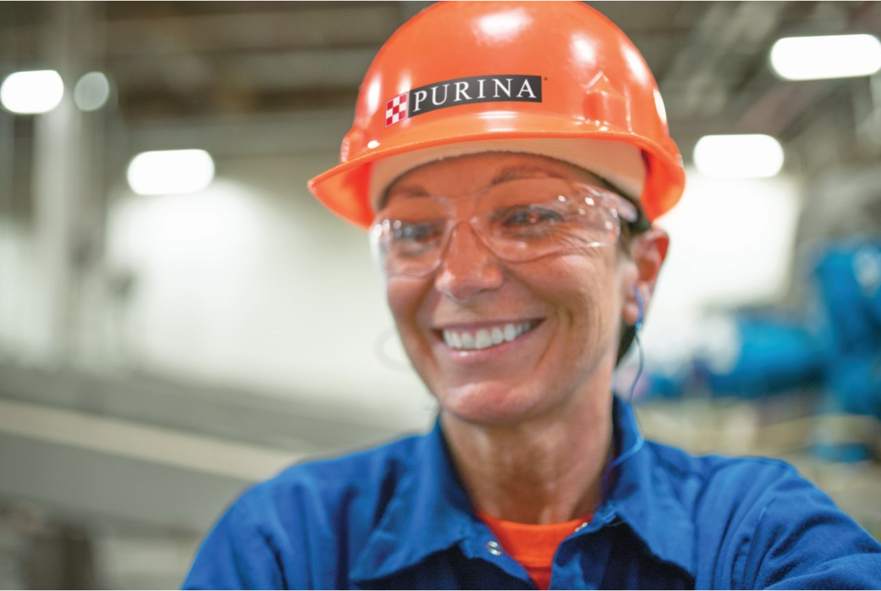 Female Purina factory working in hard hat