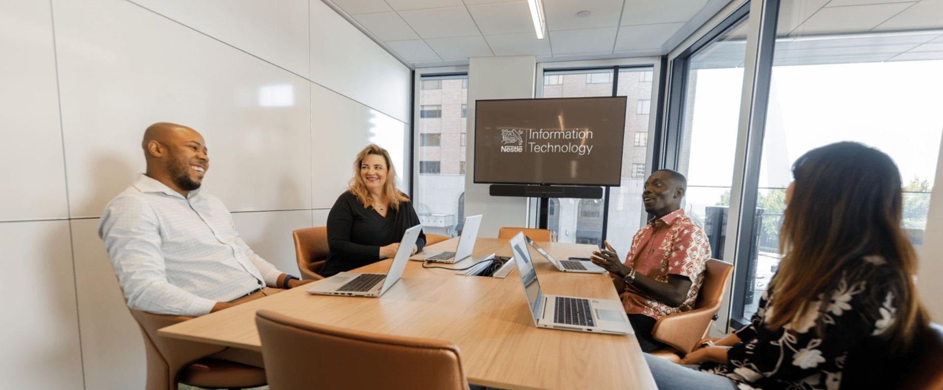 Nestle IT employees in a conference room meeting