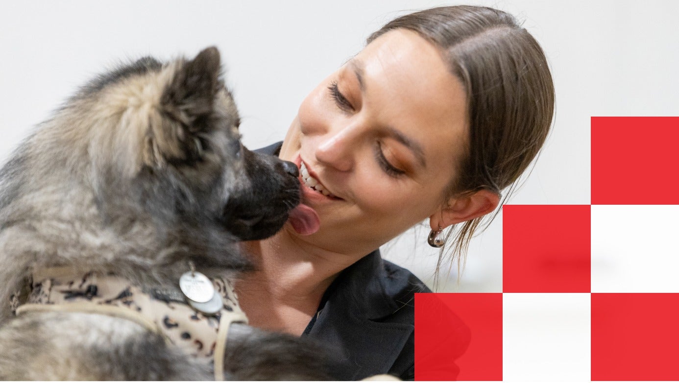 dog licking woman on face