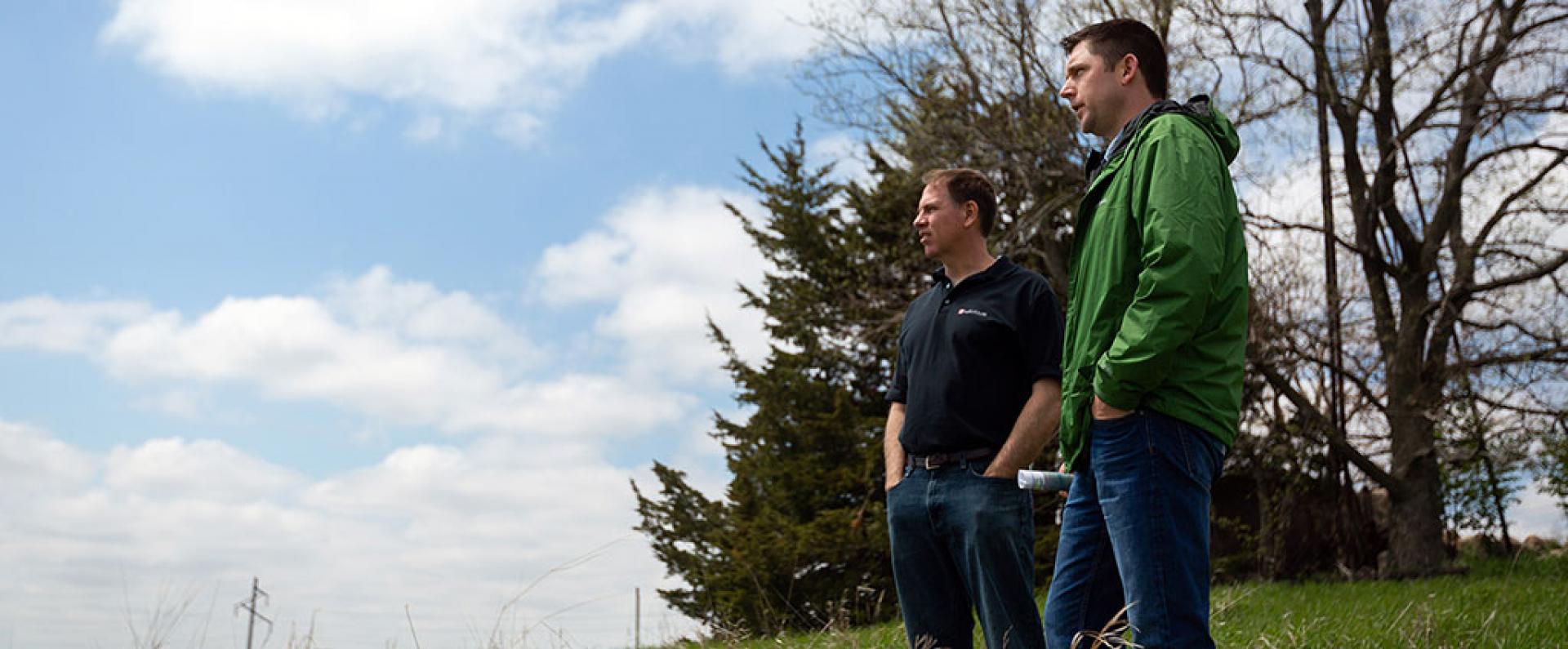 Two males standing outside